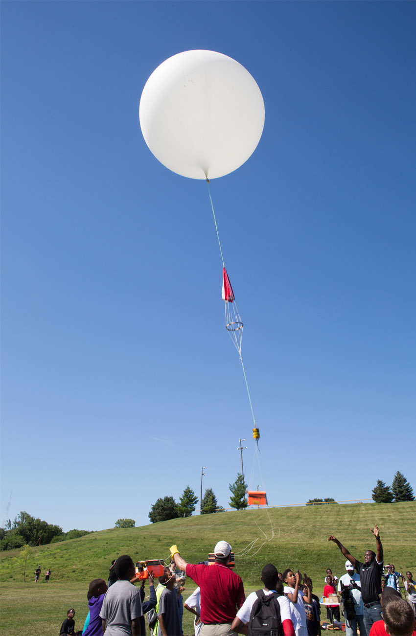 The balloon is launched into the air, carrying students' experiments