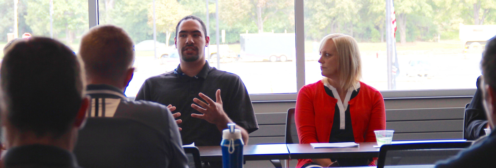 Jeffery Torres (a veteran, UNO student and Northrop Grumman intern) and employee Dawn Wildermuth share advice with students