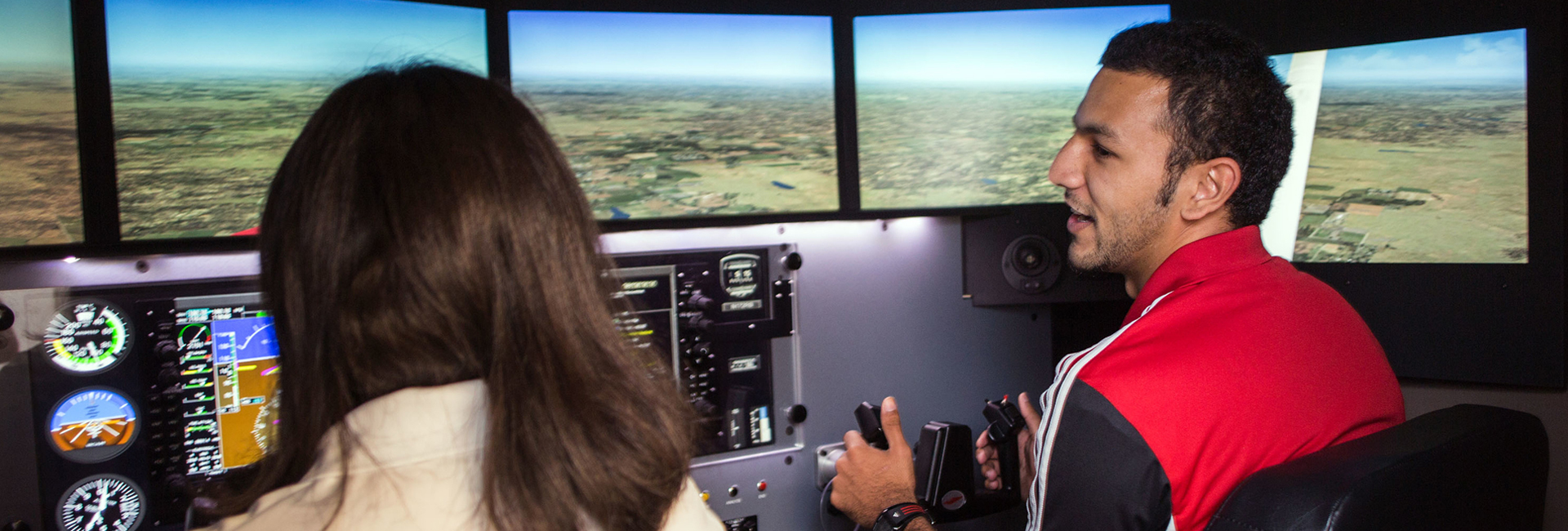 Aviation students train on a flight simulator.