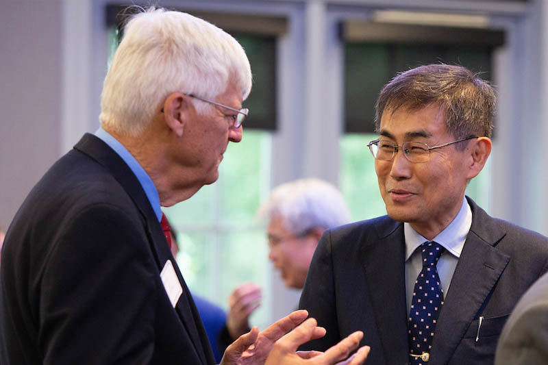 President Kiyoshi Ishii speaks with a member of the Omaha Sister Cities Association
