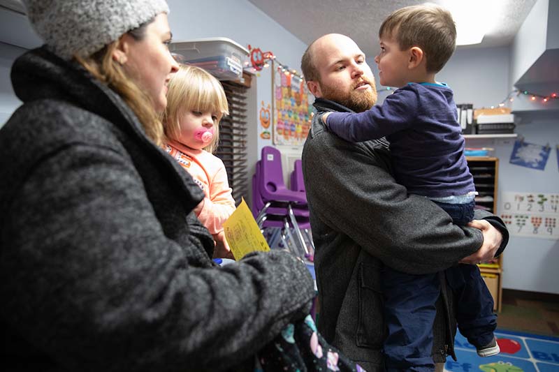 Heather and Clay Smith pick up their two children, 3-year-old Sebastian and 22-month-old Emaline. Prior to receiving support through the UNO Child Care Center, their children both went to the center half time. 