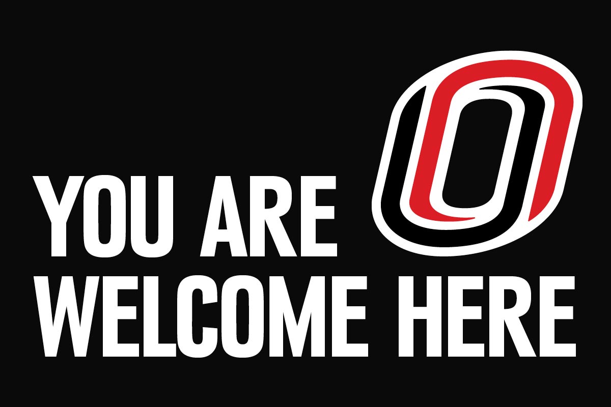 Graphic with "You Are Welcome Here" in white letters on a black background and UNO logo in upper left-hand corner