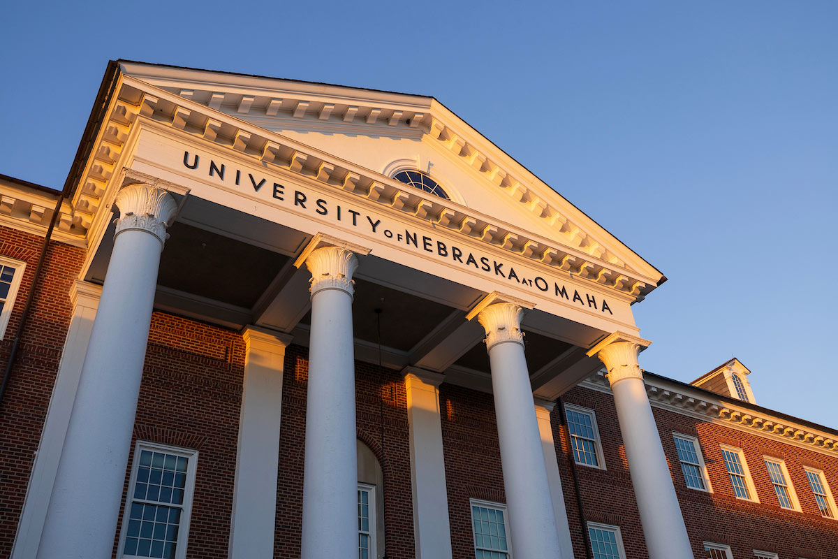 Sunrise illuminates the columns and cupola of the Arts and Sciences Hall.
