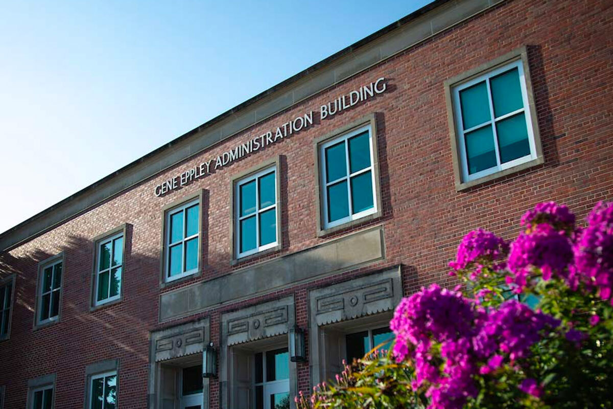 Eppley Administration Building with flowers blooming in front.