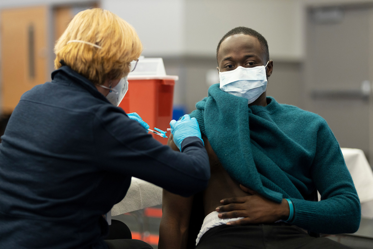 A UNO student receives a COVID-19 vaccination.