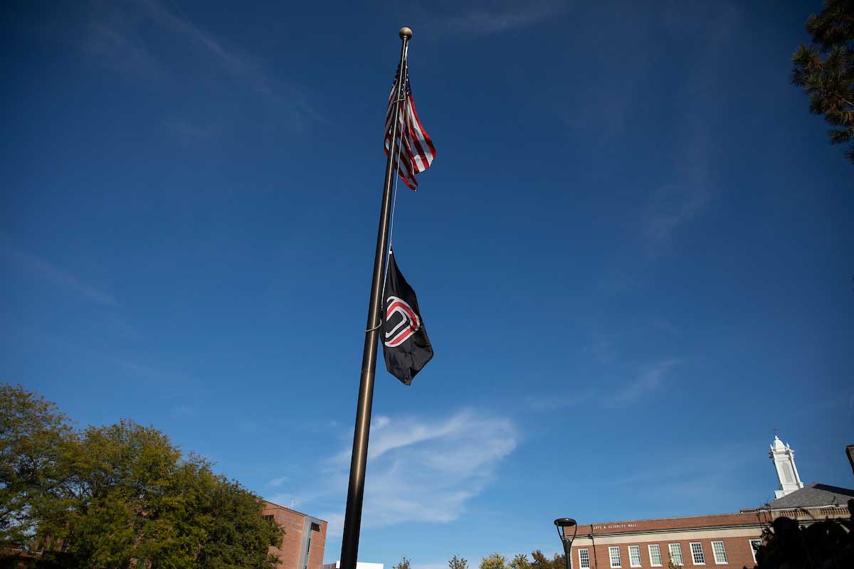 UNO flag lowered in the Pep Bowl