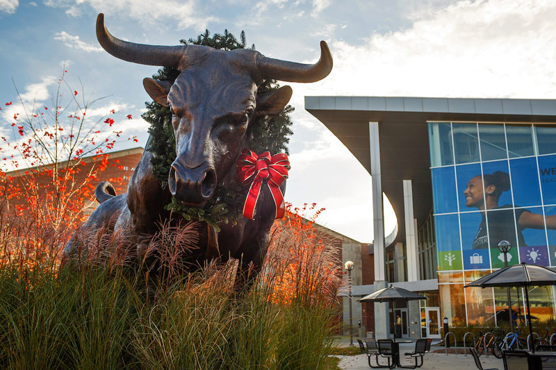 bull statute with wreath