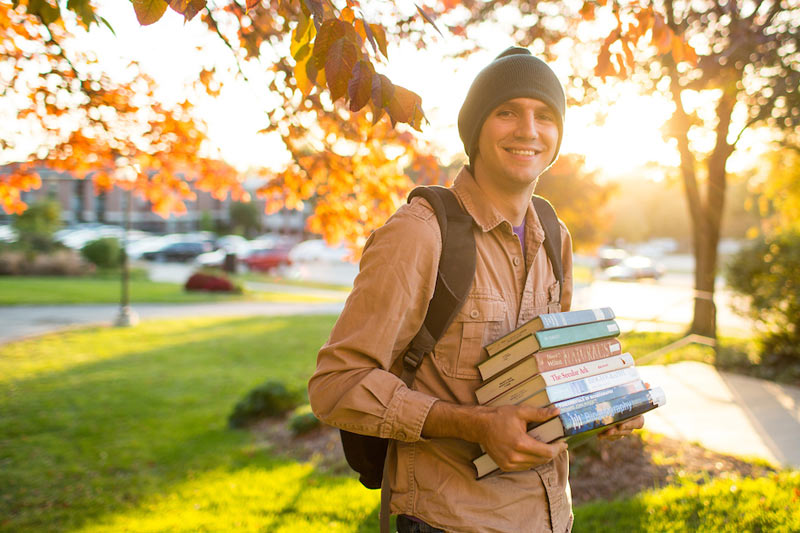 student carrying books