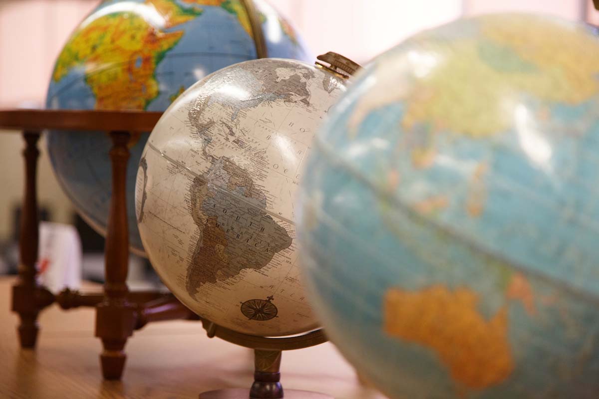 A series of globes located in UNO's International Programs office