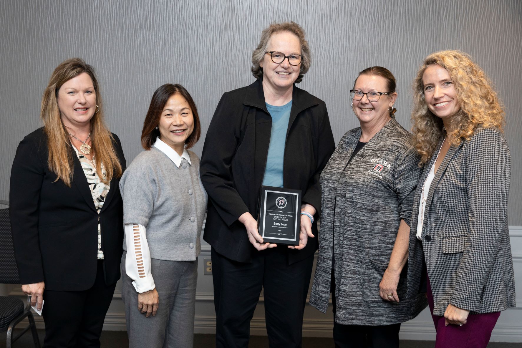 Assistant Vice Chancellor for Faculty Affairs Candice Batton (left), Chancellor Joanne Li, Betty Love, Excellence in Teaching Award recipient, Interim Senior Vice Chancellor for Academic Affairs Deborah Smith-Howell, and Interim Dean Melanie Bloom.
