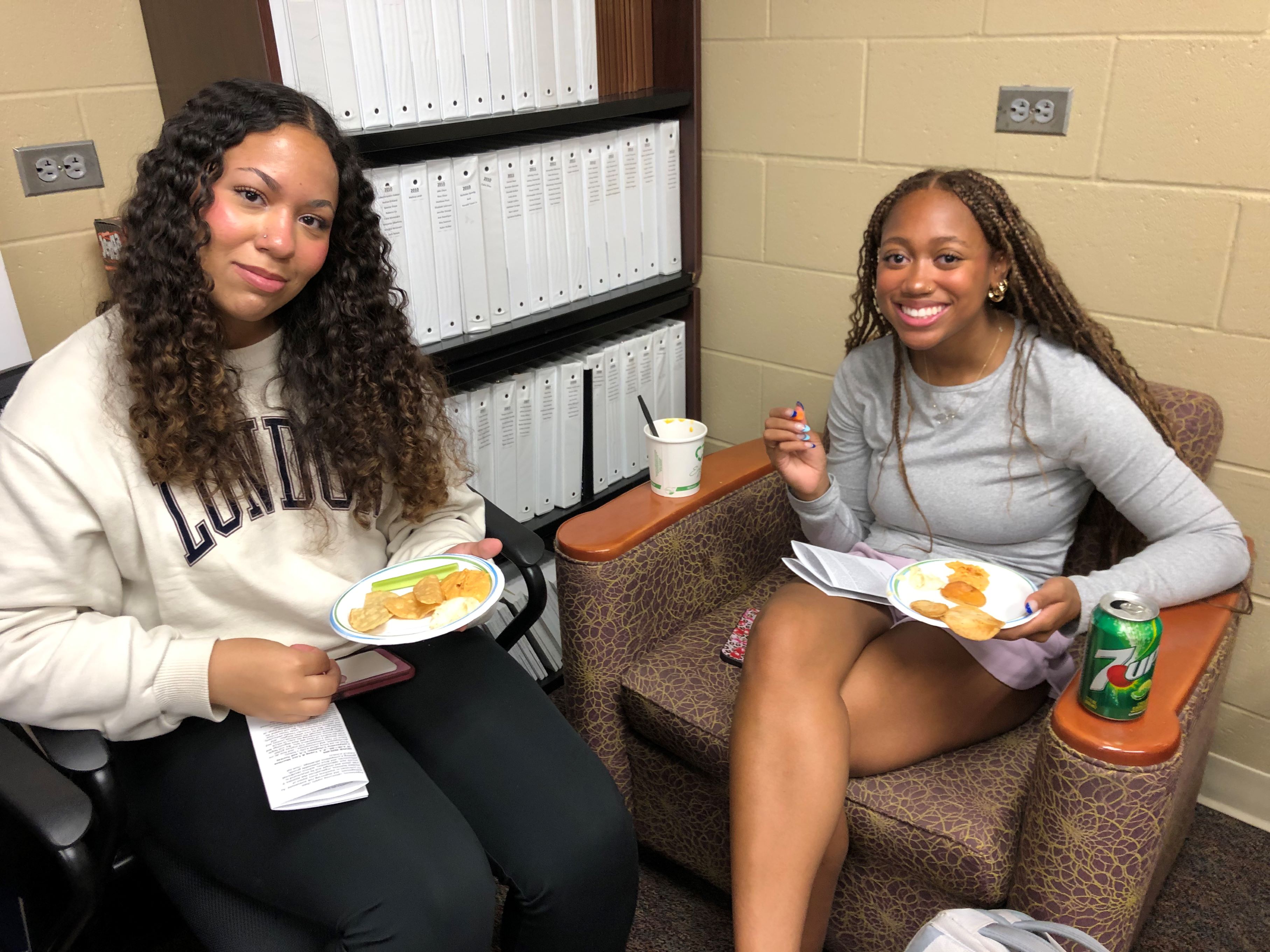 Two Honors students sitting together in a the Honors Lounge.