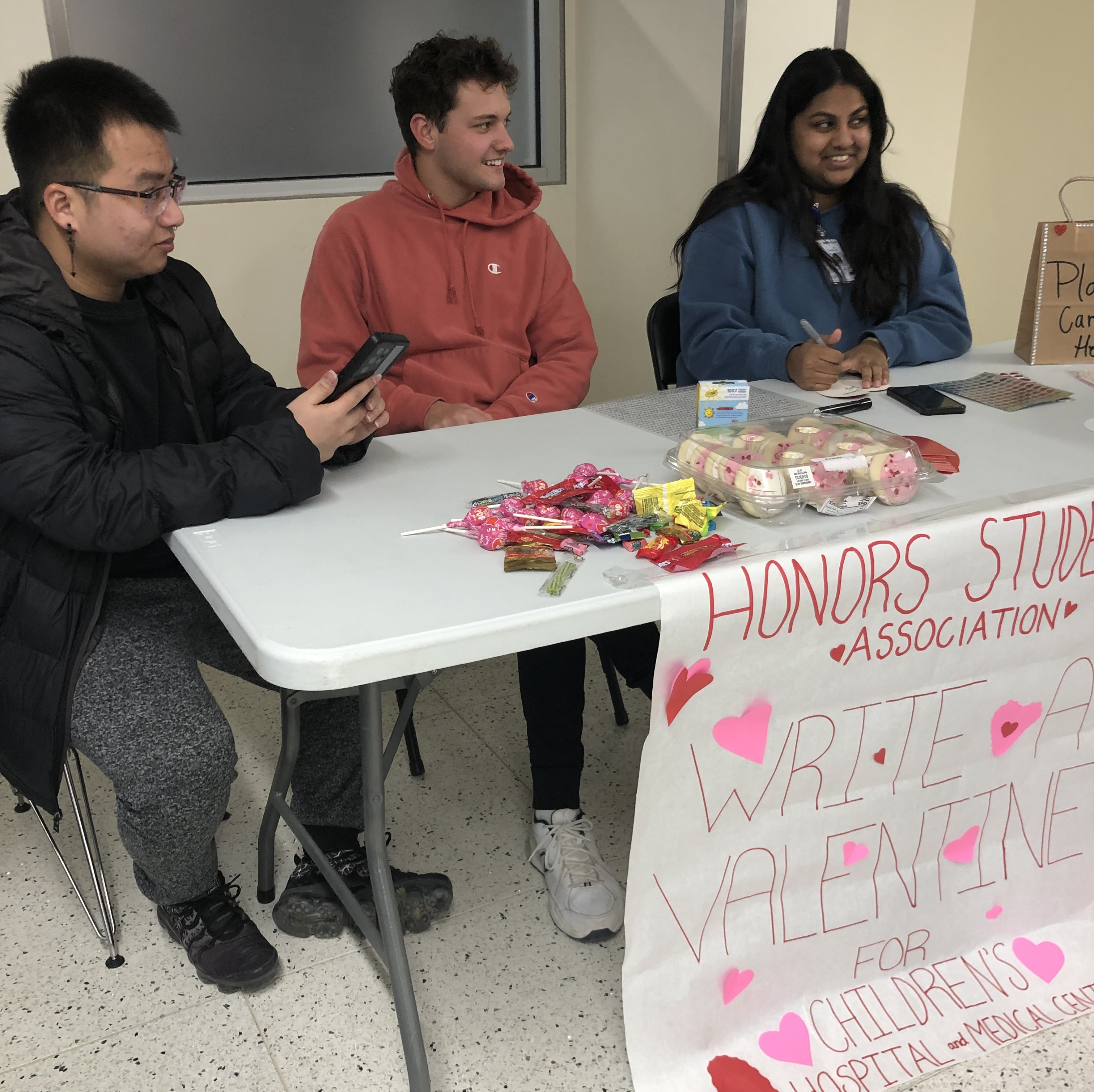 Three Honors students at Valentines table