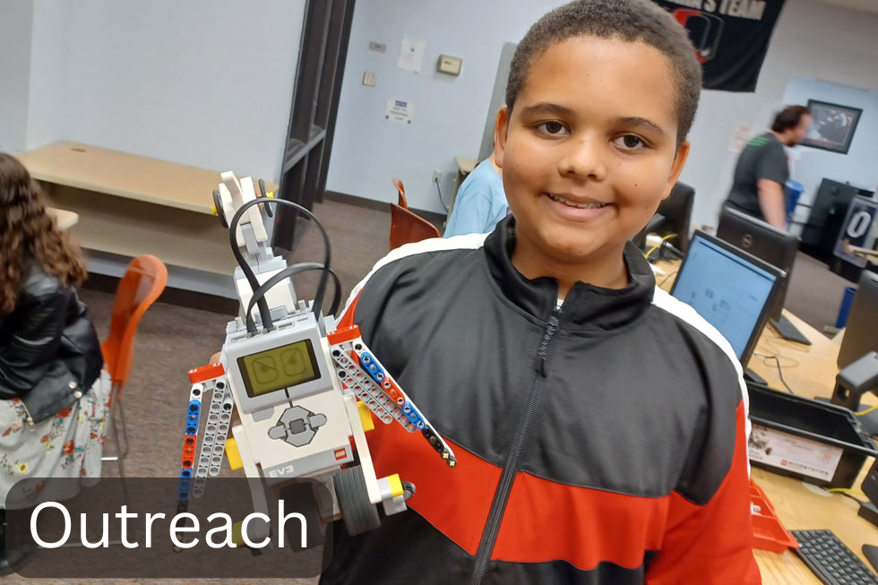 Child with handbuilt robot