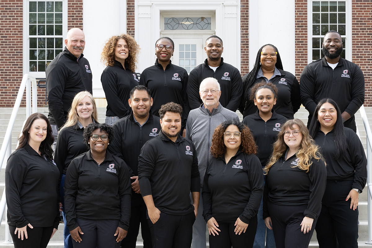 TLC Staff and Faculty group photo on stairs outside of Arts & Sciences.