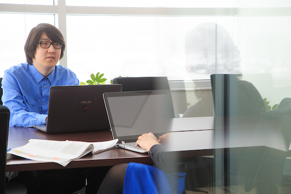 a man and woman work in an office