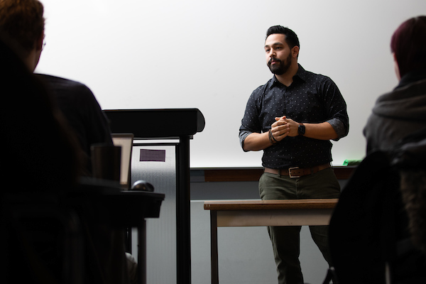 Cameron Logsdon, lecturer and Assistant Director of Forensics, teaches a class in Arts & Sciences Hall