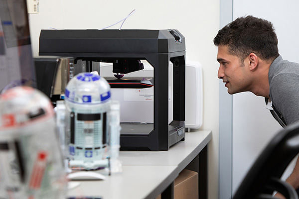 a young man working in an IT lab