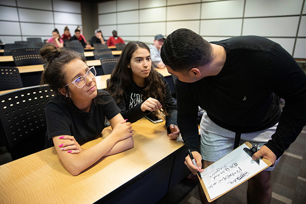 Dr. Justin Nix teaches a class on police and society as part of the School of Criminology and Criminal Justice