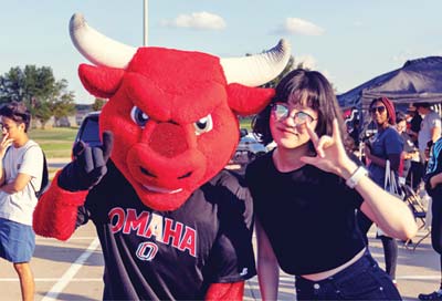 Student standing next to Durango mascot