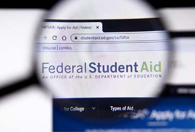 Magnifying glass over FAFSA website