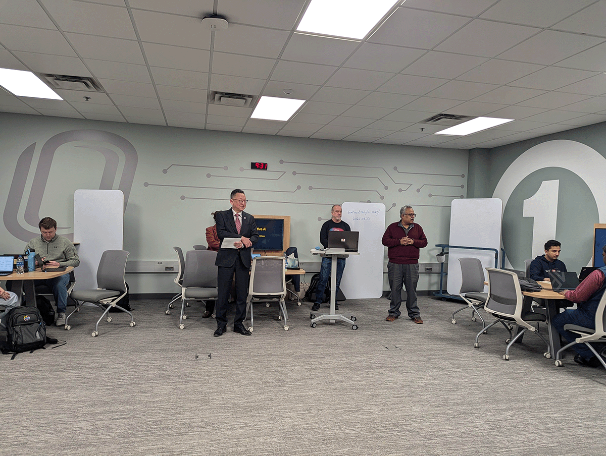 instructors standing in front of class.