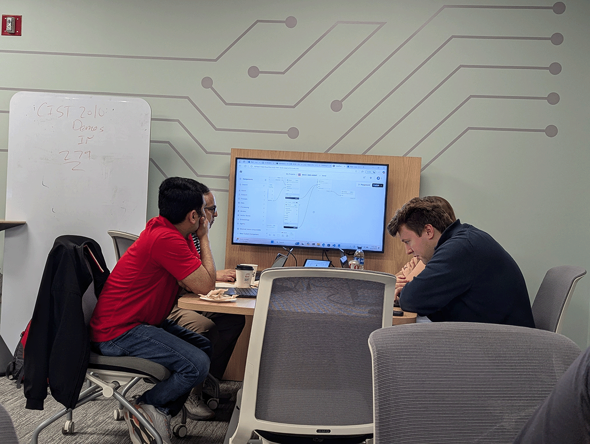 students sitting at a table working.