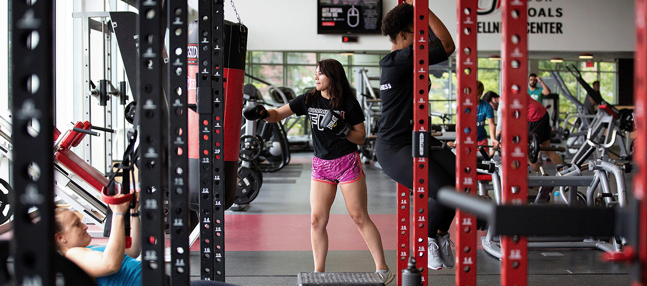 people working out in a gym.