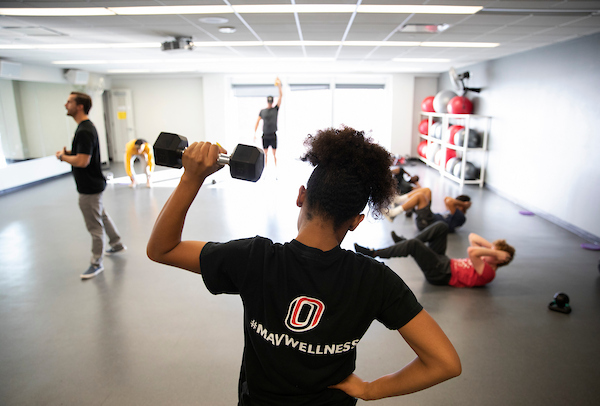 people working out in a class.