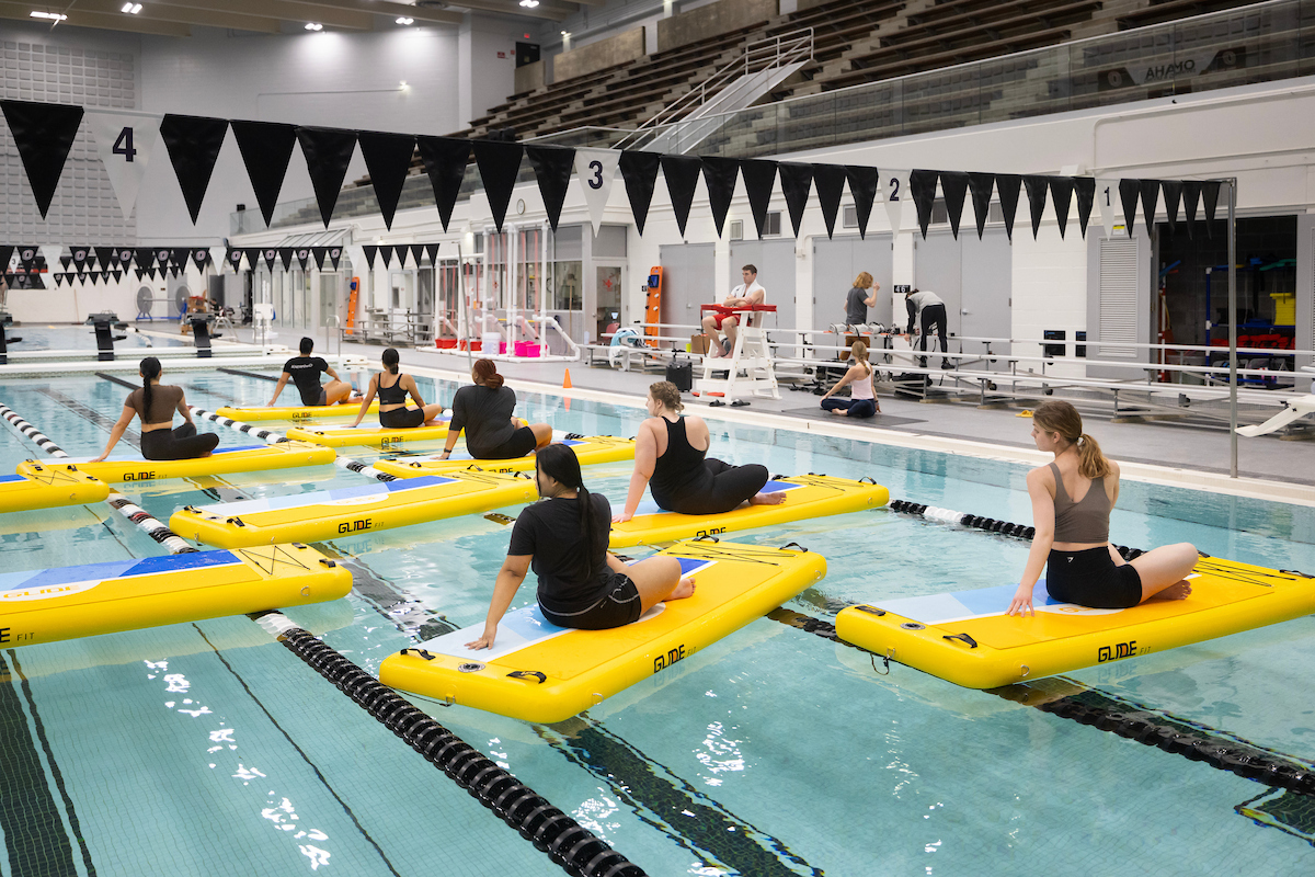 UNO students participate in SUP Yoga at H&K.