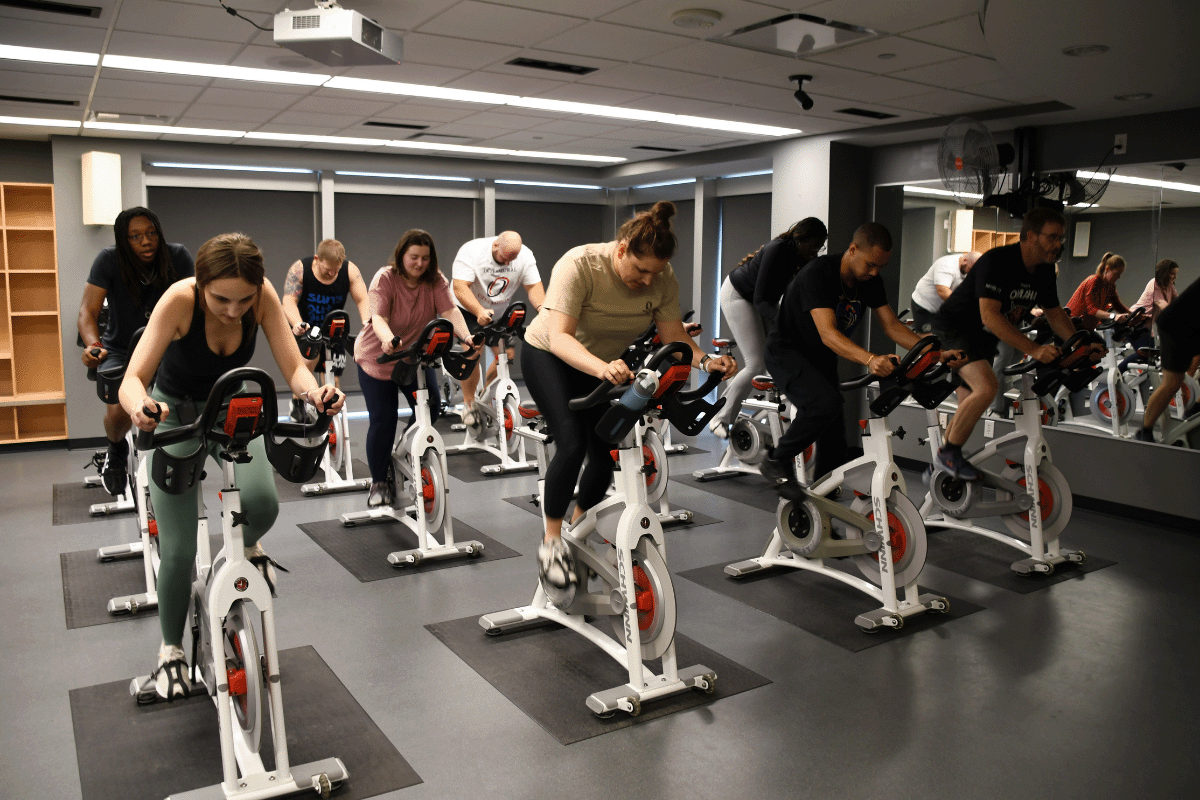 people in a spin class in H&K.