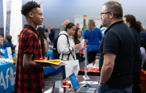 A student speaking to an employer.