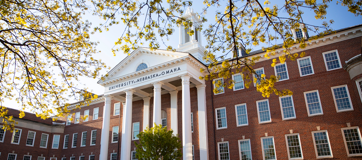 Arts and Sciences Hall surrounded by leaves