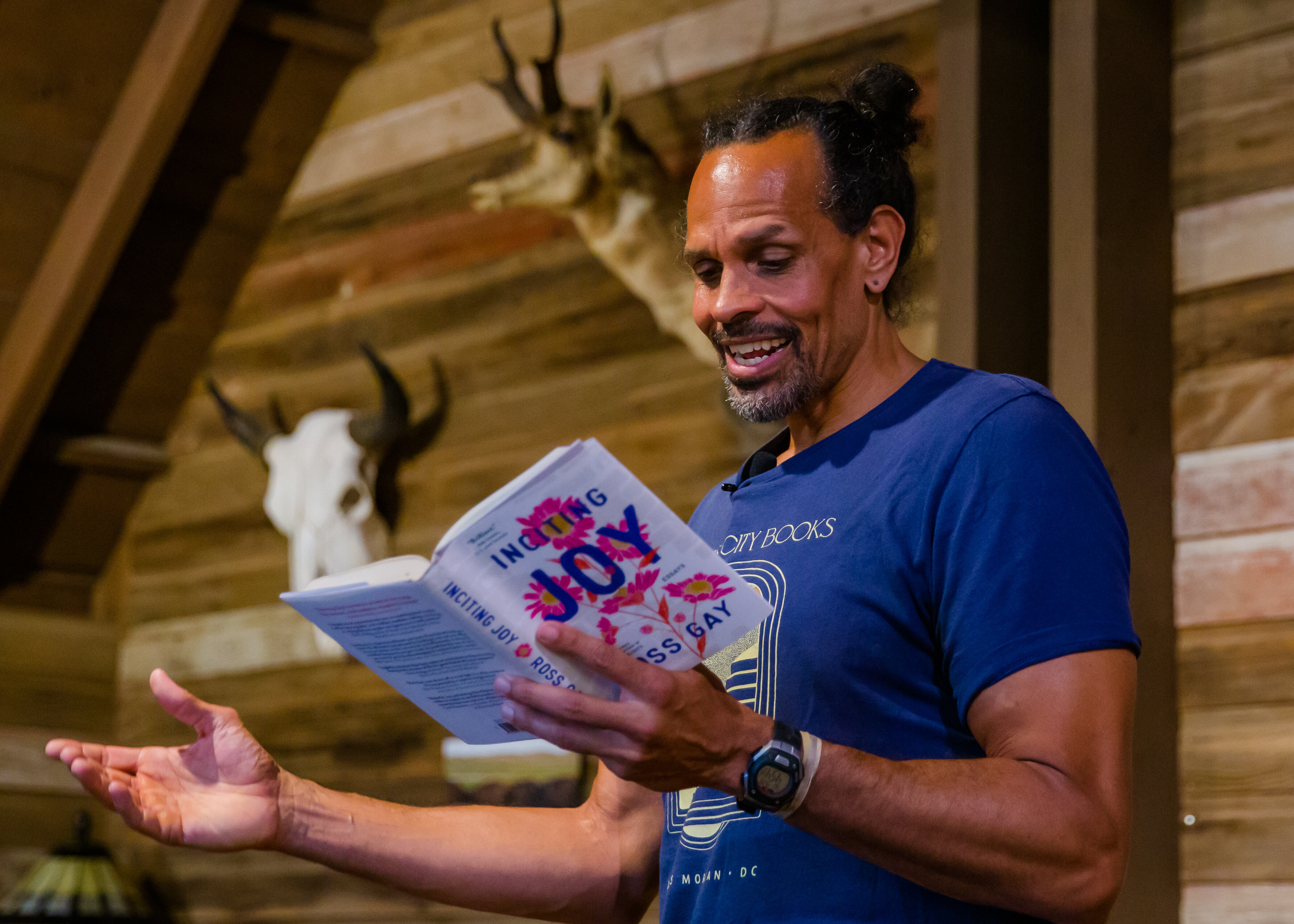 Author Ross Gay reads from his book, "Inciting Joy," at a UNO event
