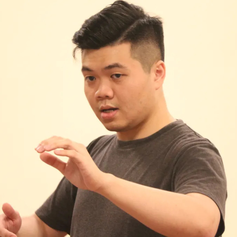 Chris Lee teaches in a classroom.