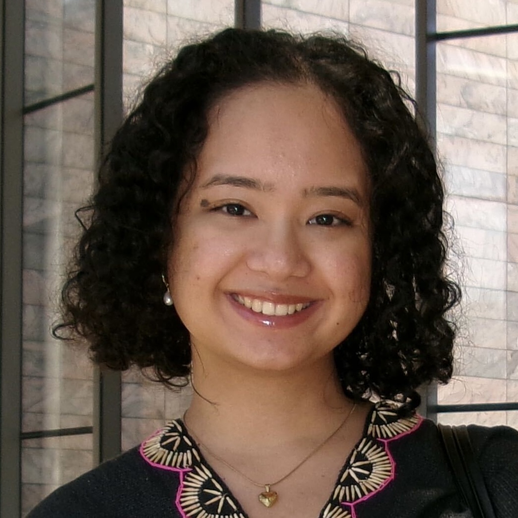 Moolaw Soe portrait outdoors with glass panes on the background