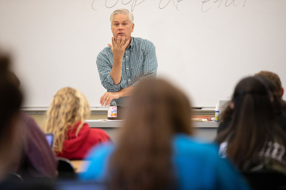 Dr. Mark Scherer speaking to students in classroom