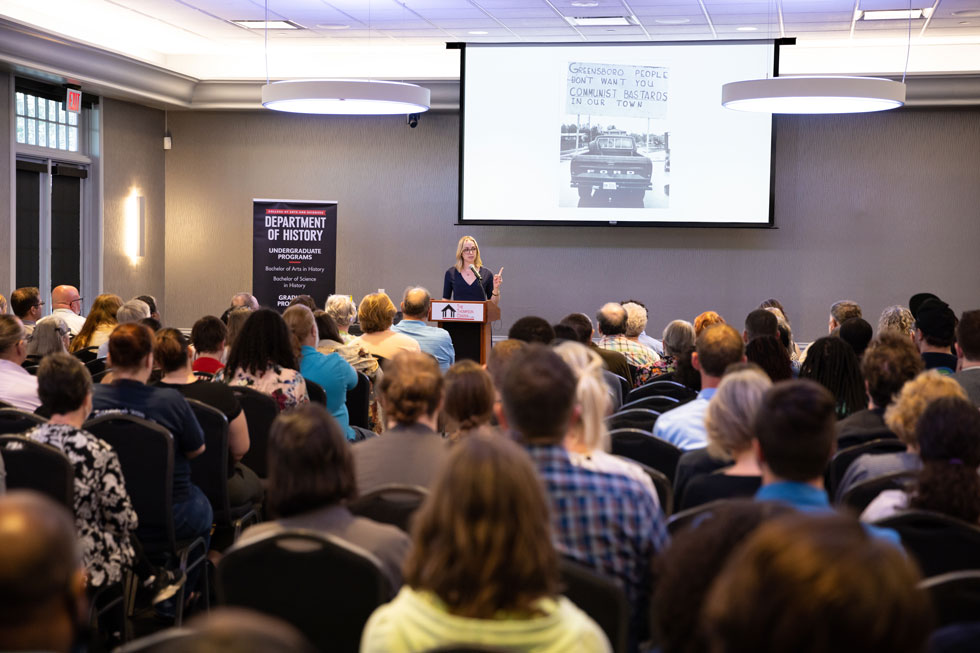 Dr. Kathleen Belew speaking to crowd at Winchell lecture