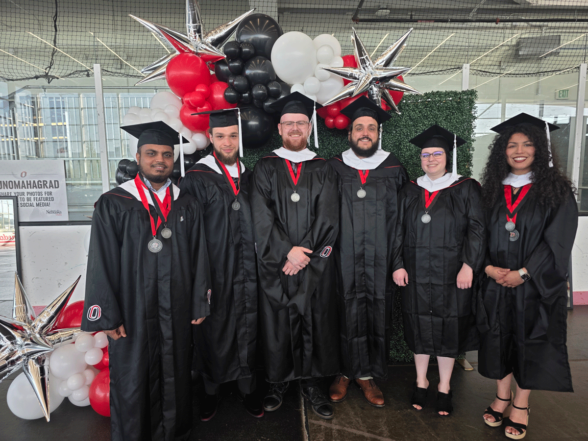 Graduate students smiling together.