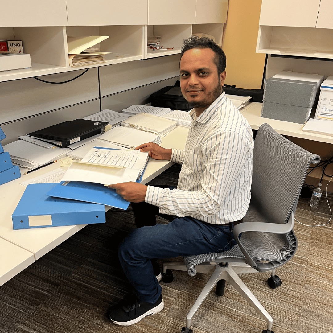 Student working with papers at a desk
