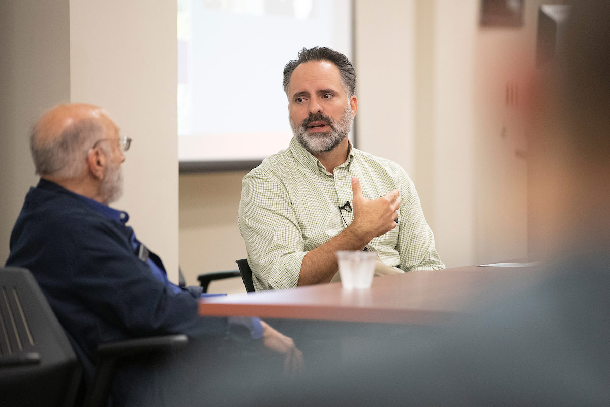 Troy Romero leads a discussion with artist Samuel Bak