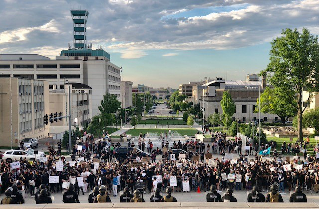 Wide shot of protesters in downtown Lincoln