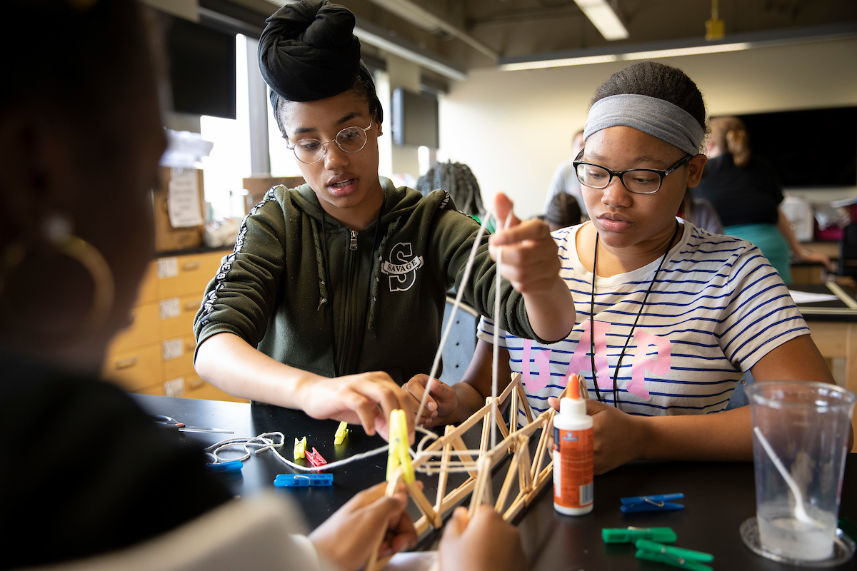 Girls Inc. students build bridges during Eureka! STEM Camp.