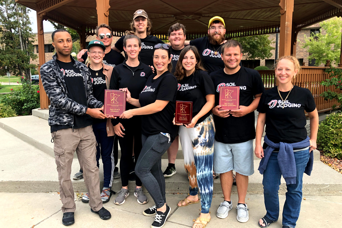 Group picture of the 2021 soil judging team holding the award plaque.