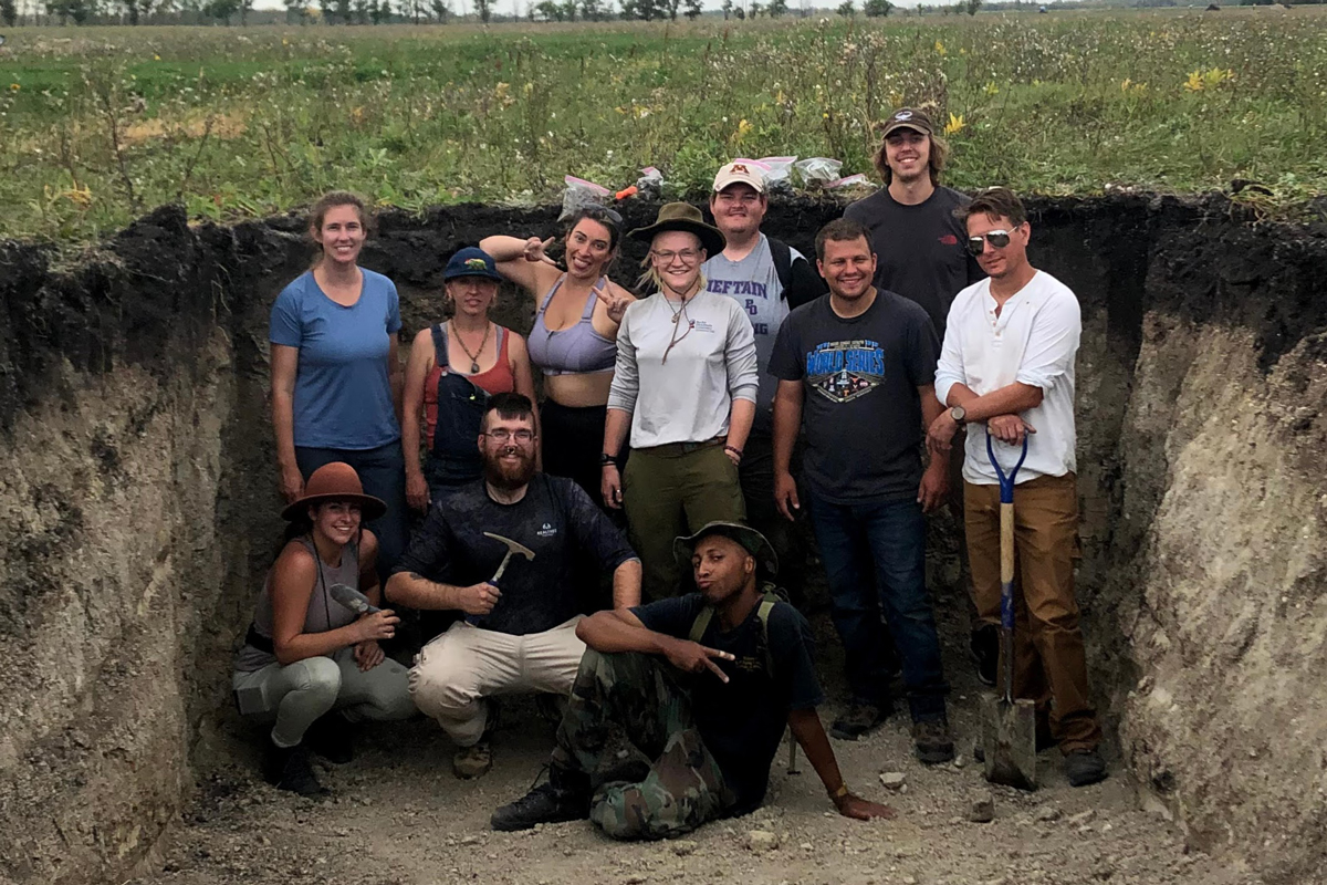 Group picture of the 2021 soil judging team posing in the competition pit.