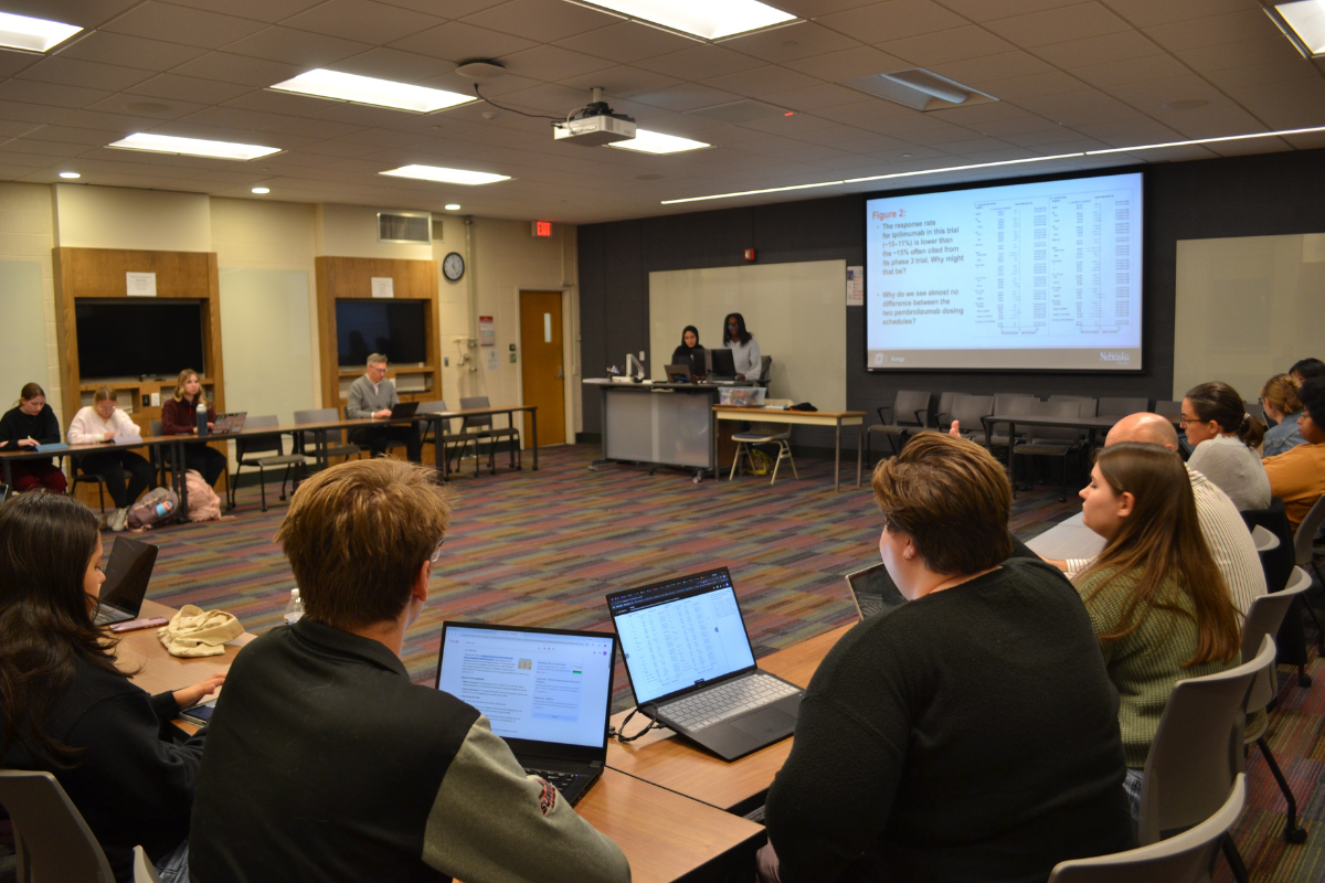 Students sit in Journal Club and discuss a reading. 