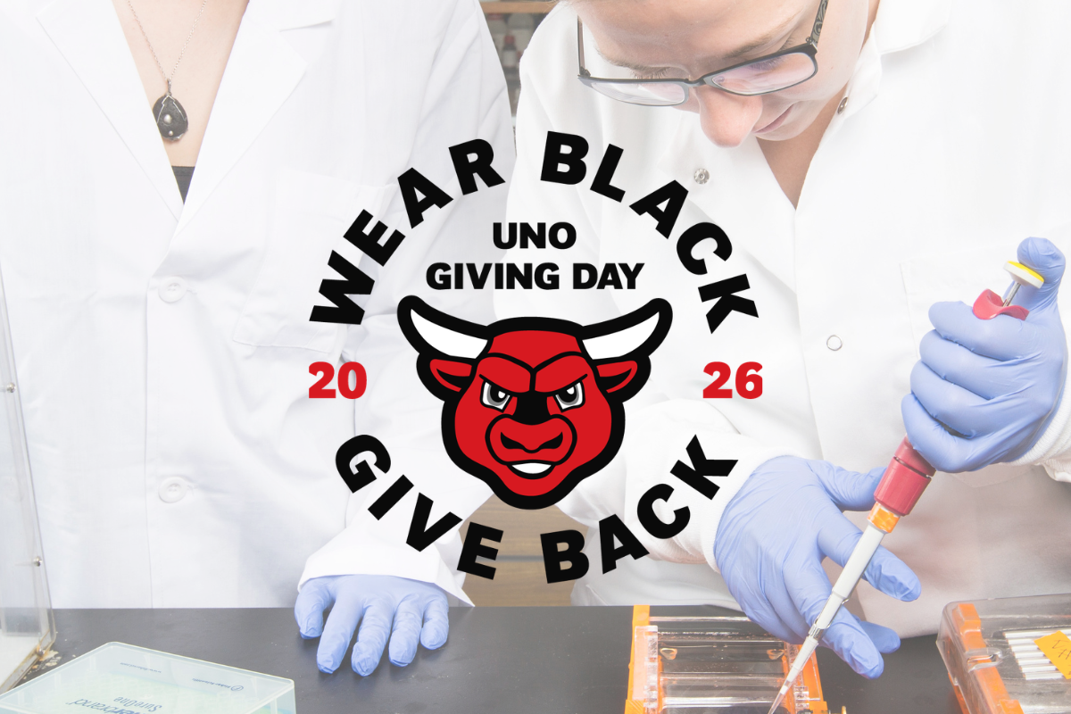 Students use a pipette in a lab. Over the image is the text: Wear Black, Give Back 2026.