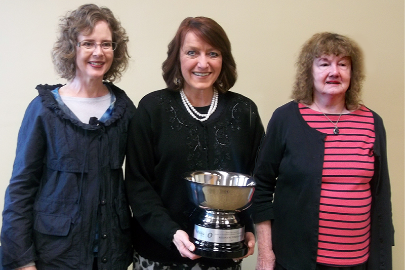 Gina Toman stands between Karen Falconer Al-HIndi and Mary Ann Lamanna.