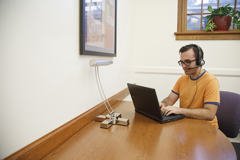 a man works on a laptop