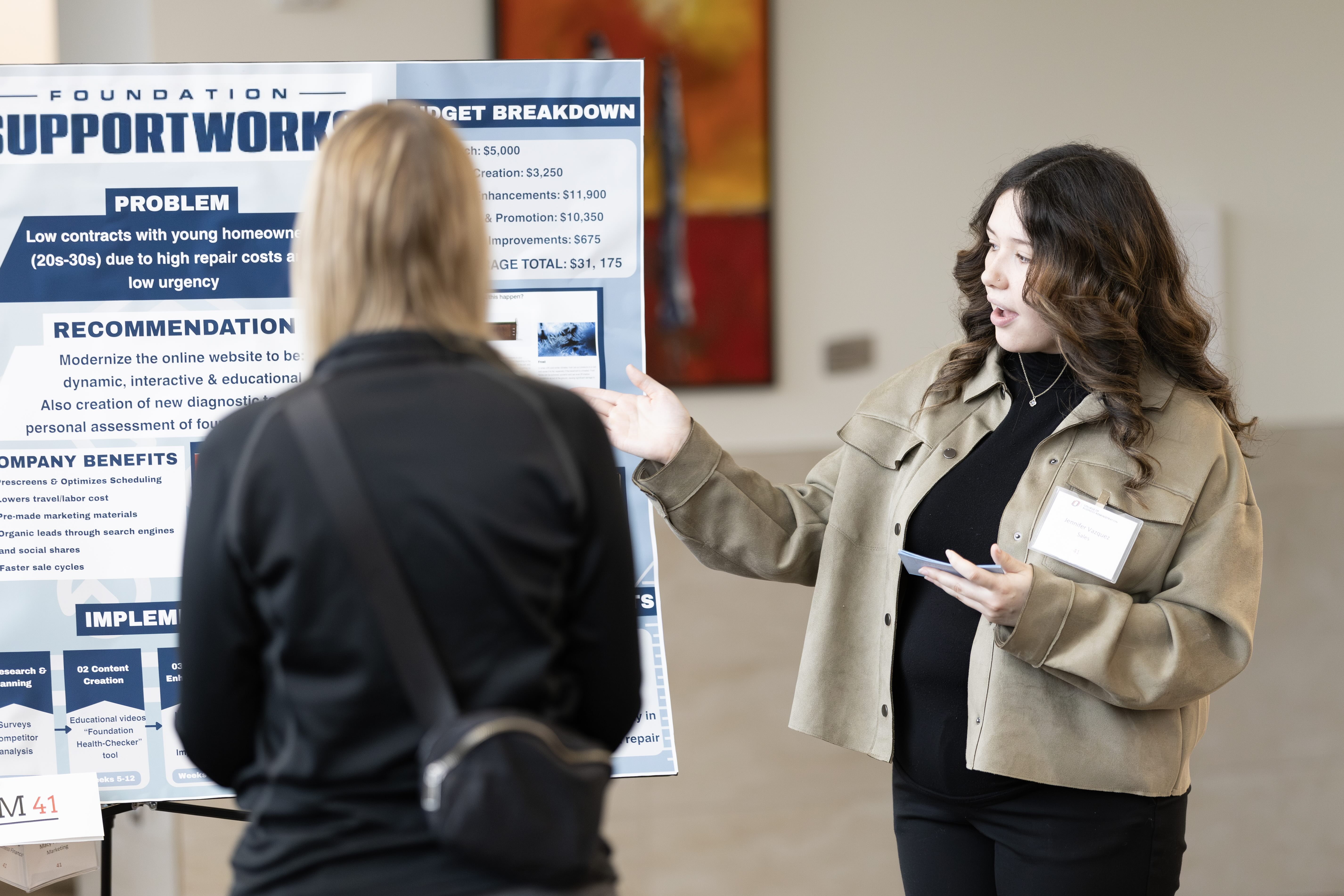 Student presenting poster