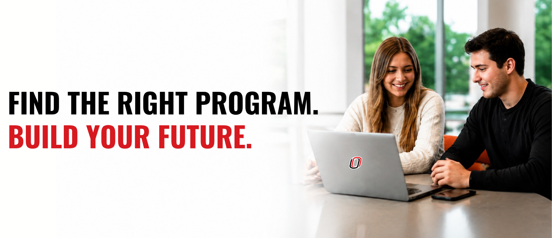 Banner featuring the text "Find the Right Program. Build Your Future." beside two students collaborating on a laptop in a bright, modern campus study space with a soft white gradient background for text overlay.